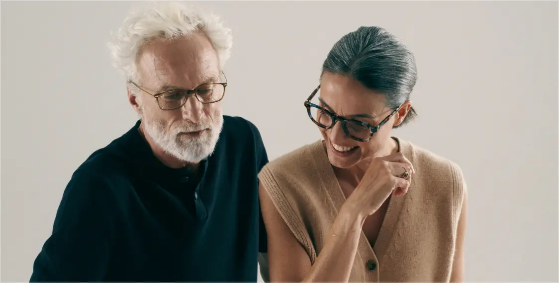 Man with his Multi-Distance glasses, coffee in hand, chatting in his kitchen