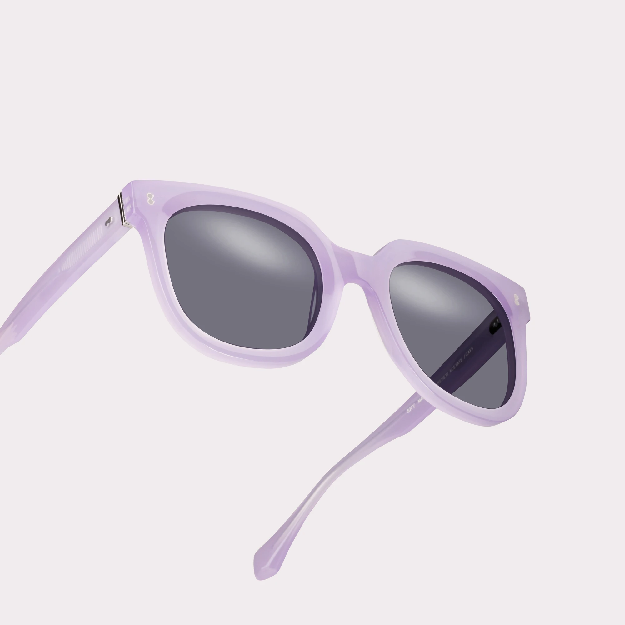 A pair of Sky Mauve Sunglasses in a macro view