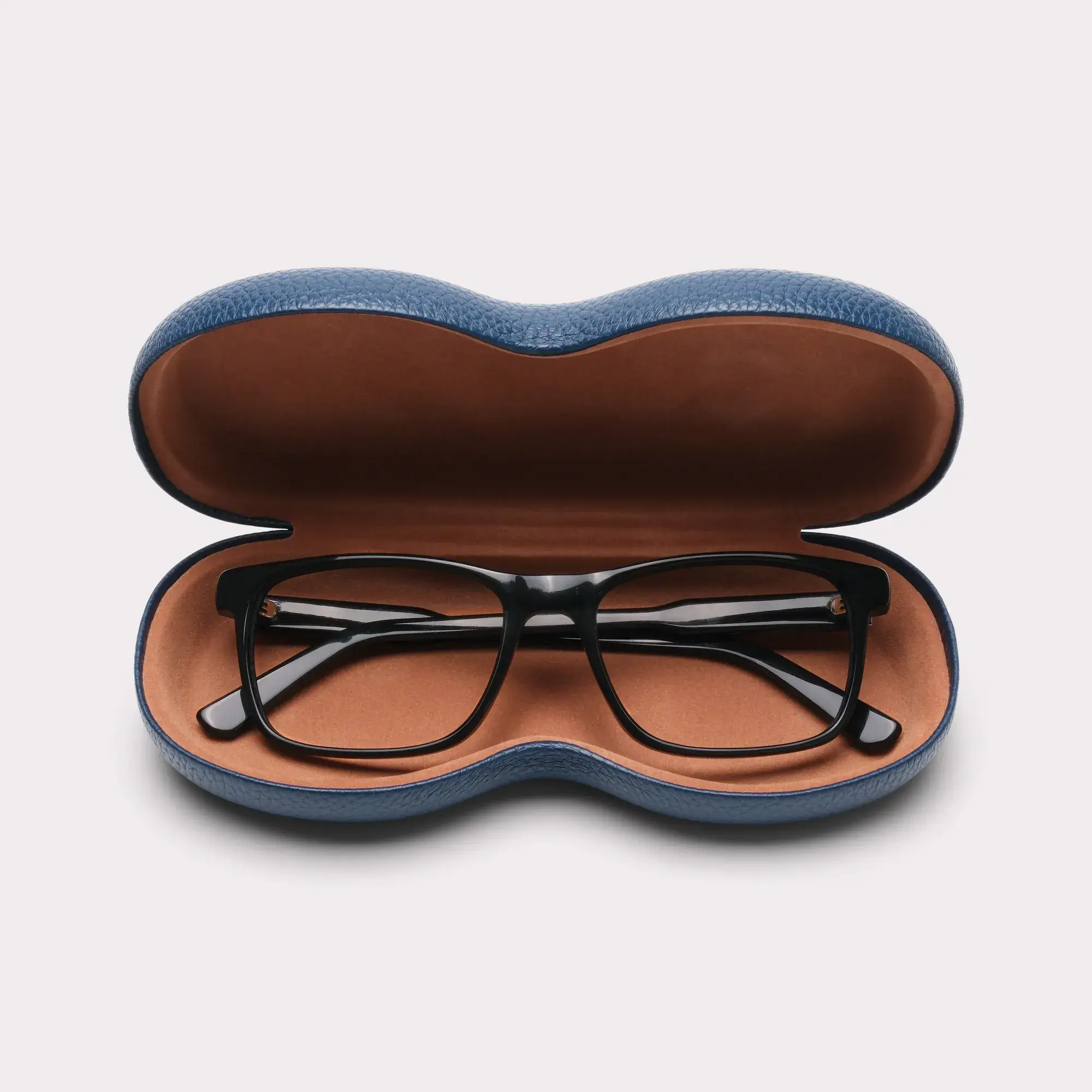 A pair of Justin Black Multi-distance™ blue light blocking reading glasses coming out of its case