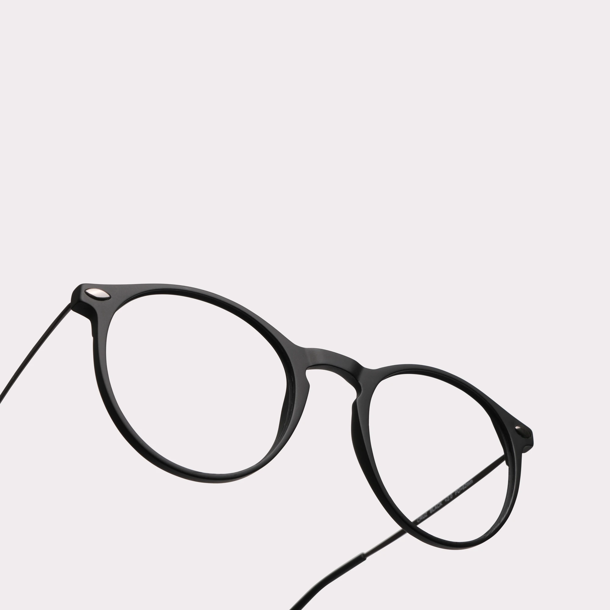 A pair of Cruz Black Multi-distance™ blue light blocking reading glasses in a macro view