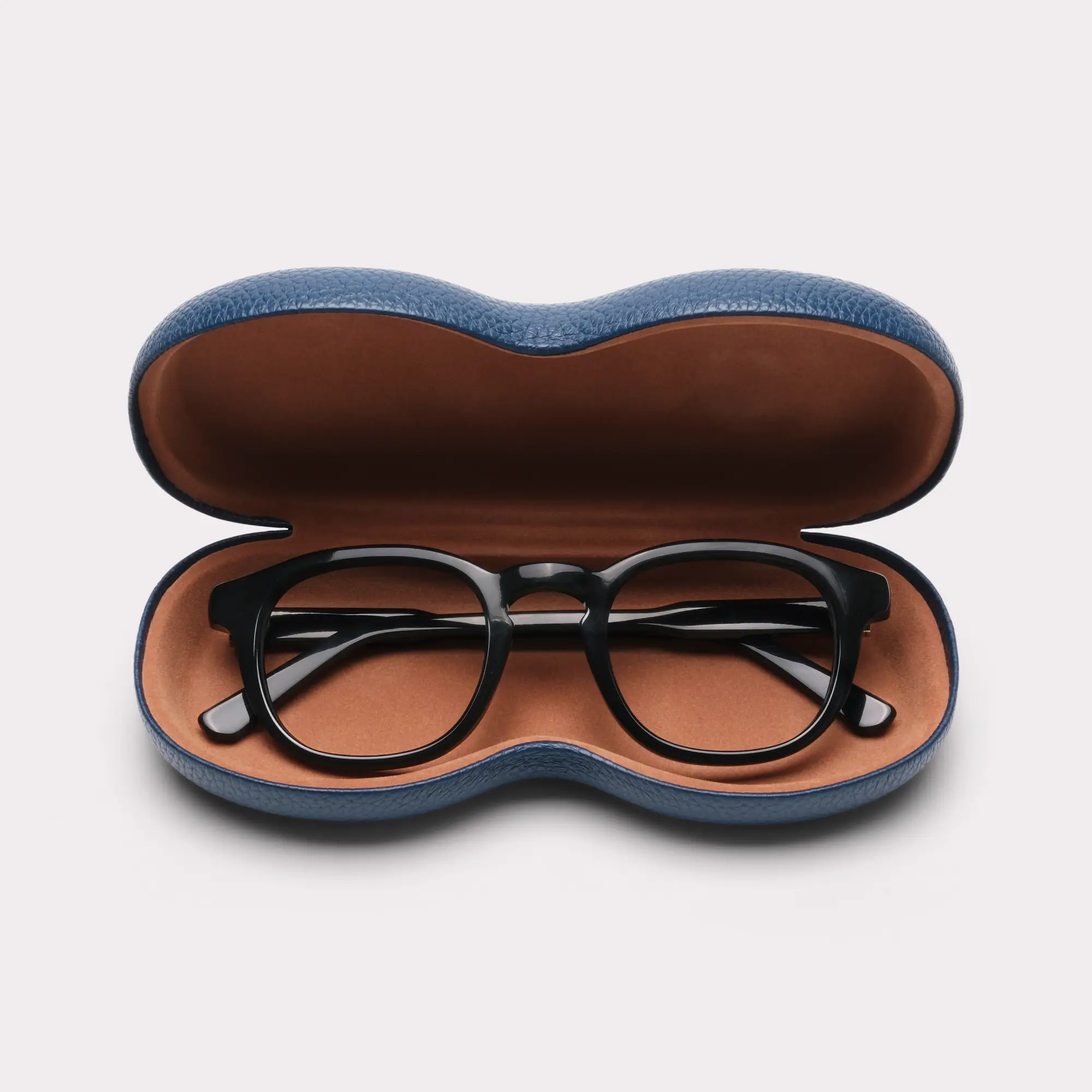 A pair of Loen Black Multi-distance™ blue light blocking reading glasses coming out of its case