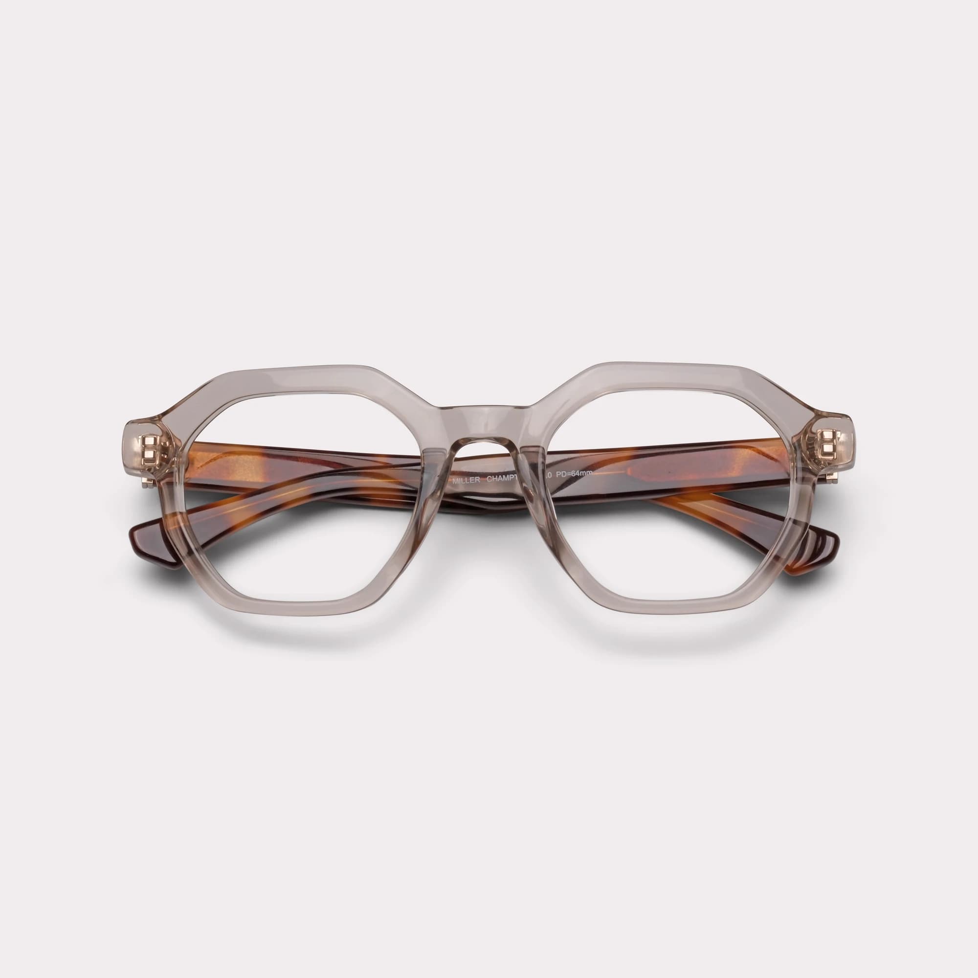 Um par de Miller Champagne tortoise Óculos de leitura multi-distância™ de luz azul dobrado