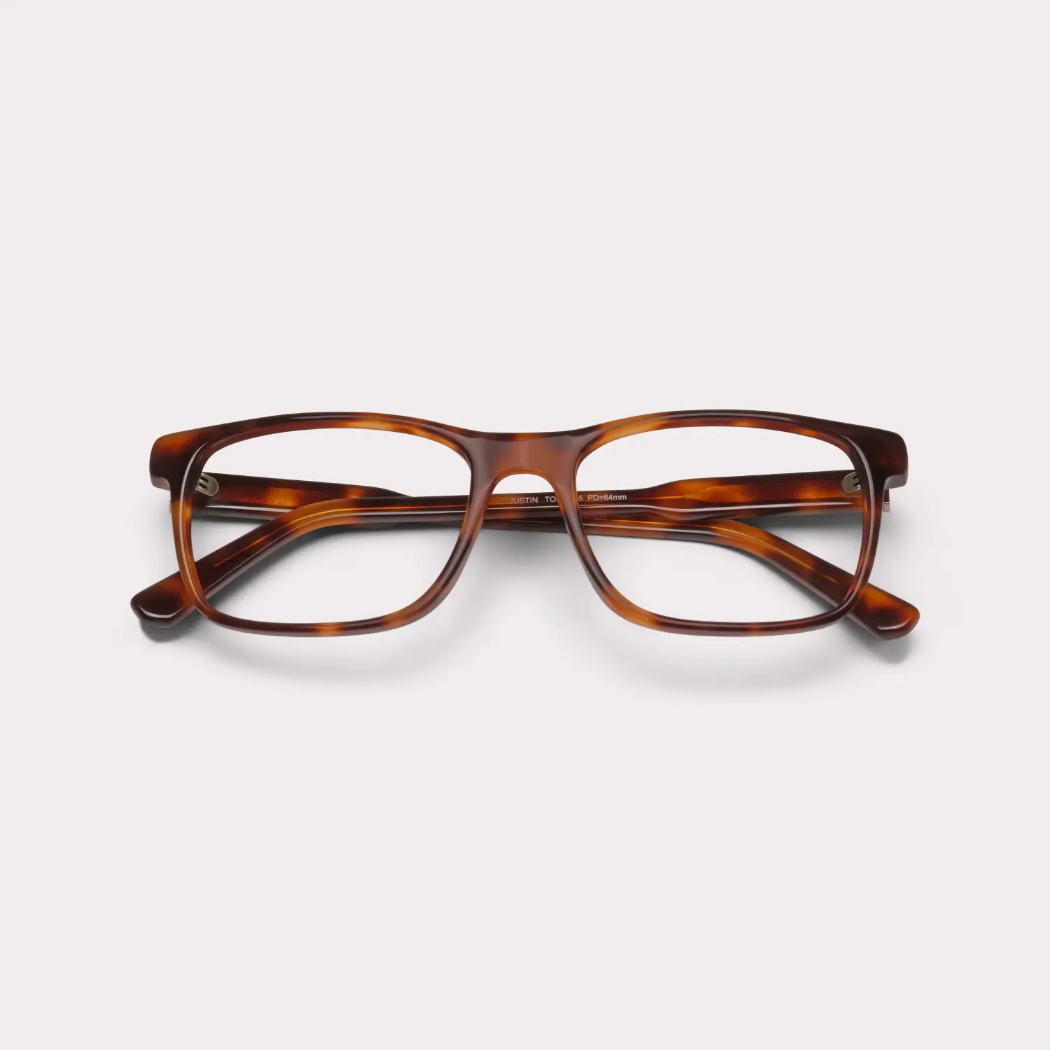 A pair of Justin Tortoise Reading glasses folded