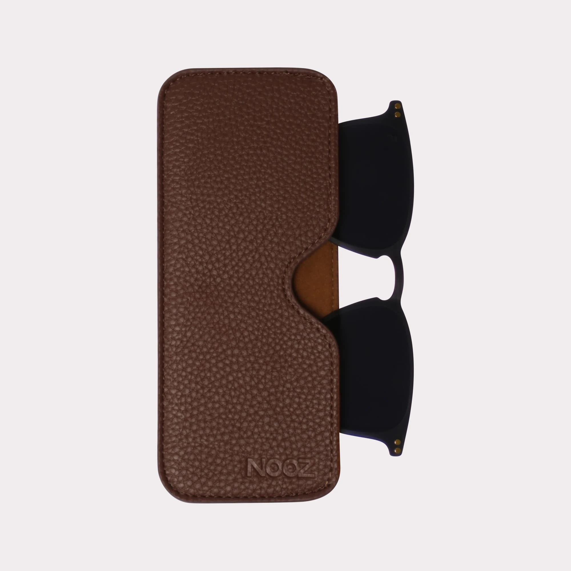 A pair of Oscar Grey Clip coming out of its case