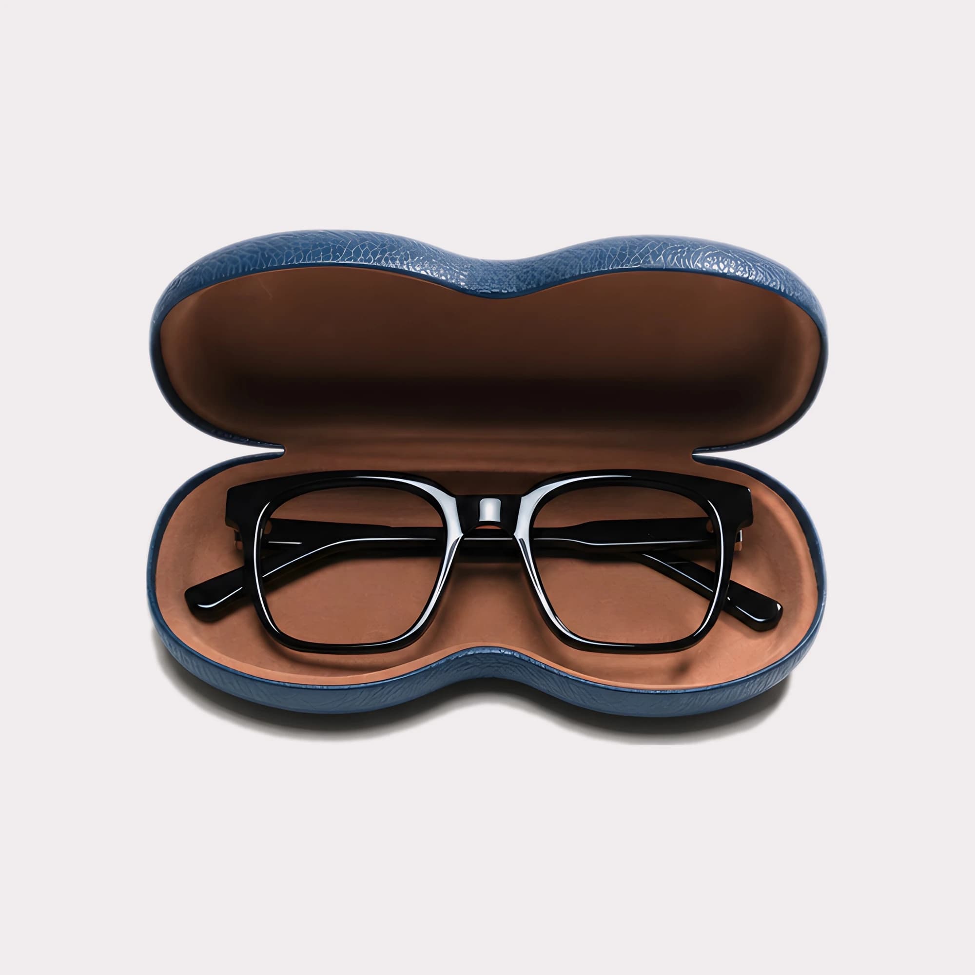 A pair of Venn Black Reading glasses coming out of its case