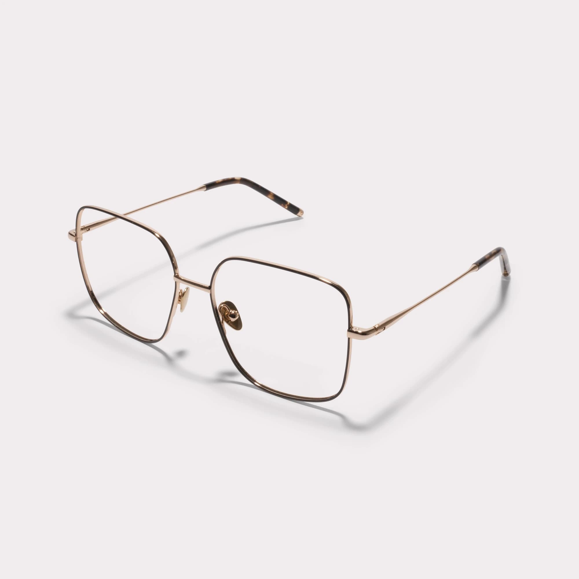 A pair of Cleo Gold Prescription glasses seen from the side