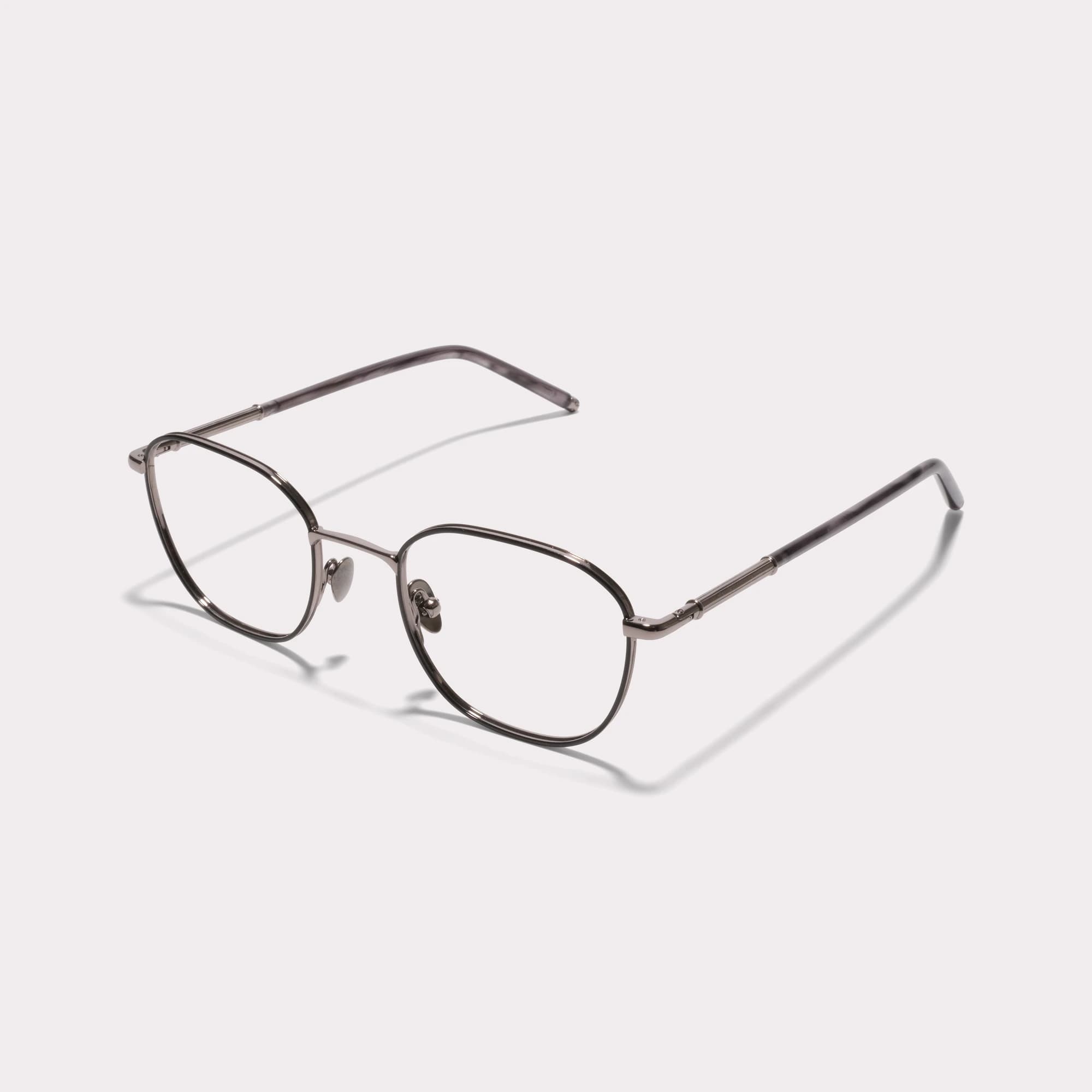 A pair of Josh Silver Prescription glasses seen from the side