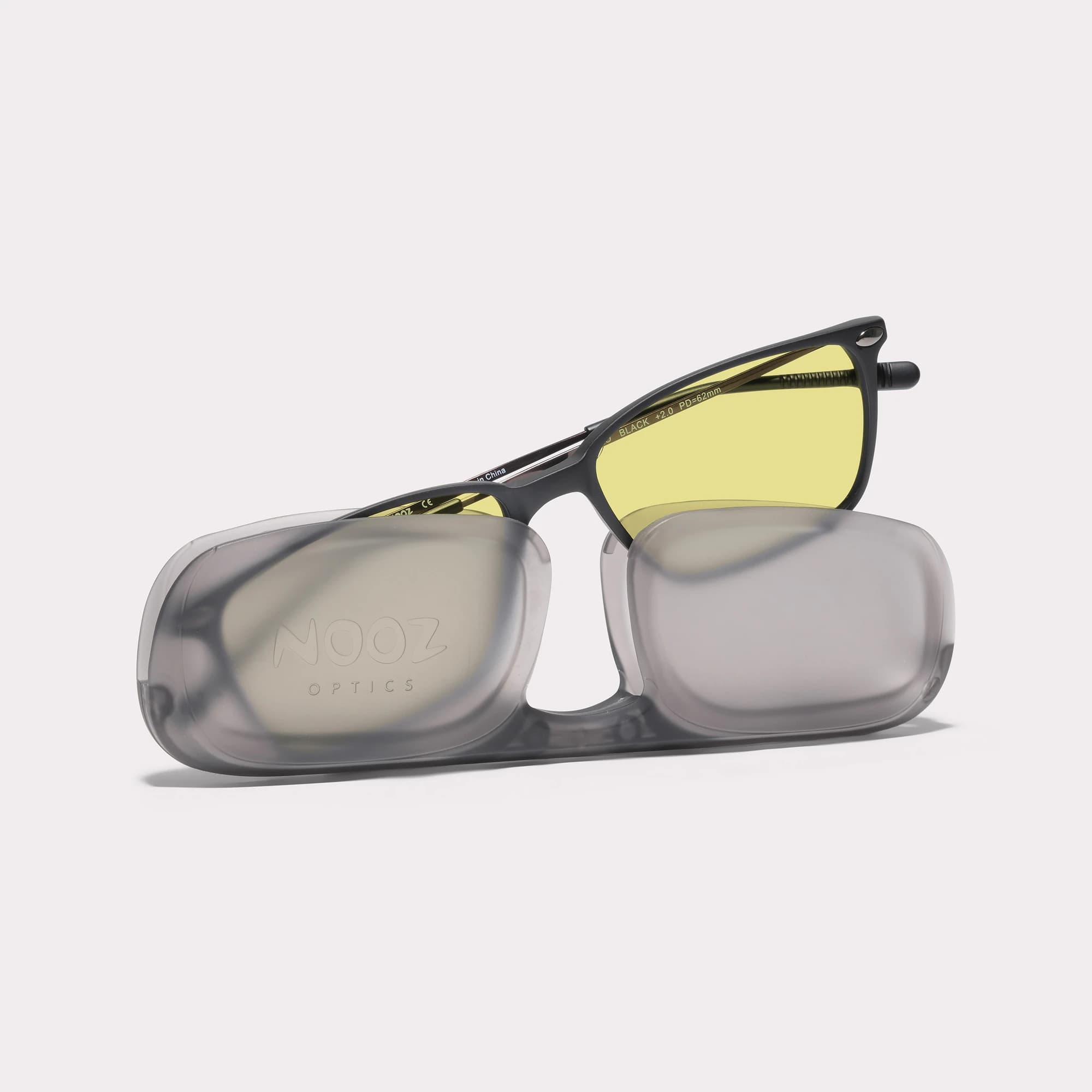 A pair of Bao Black Driving Glasses coming out of its case
