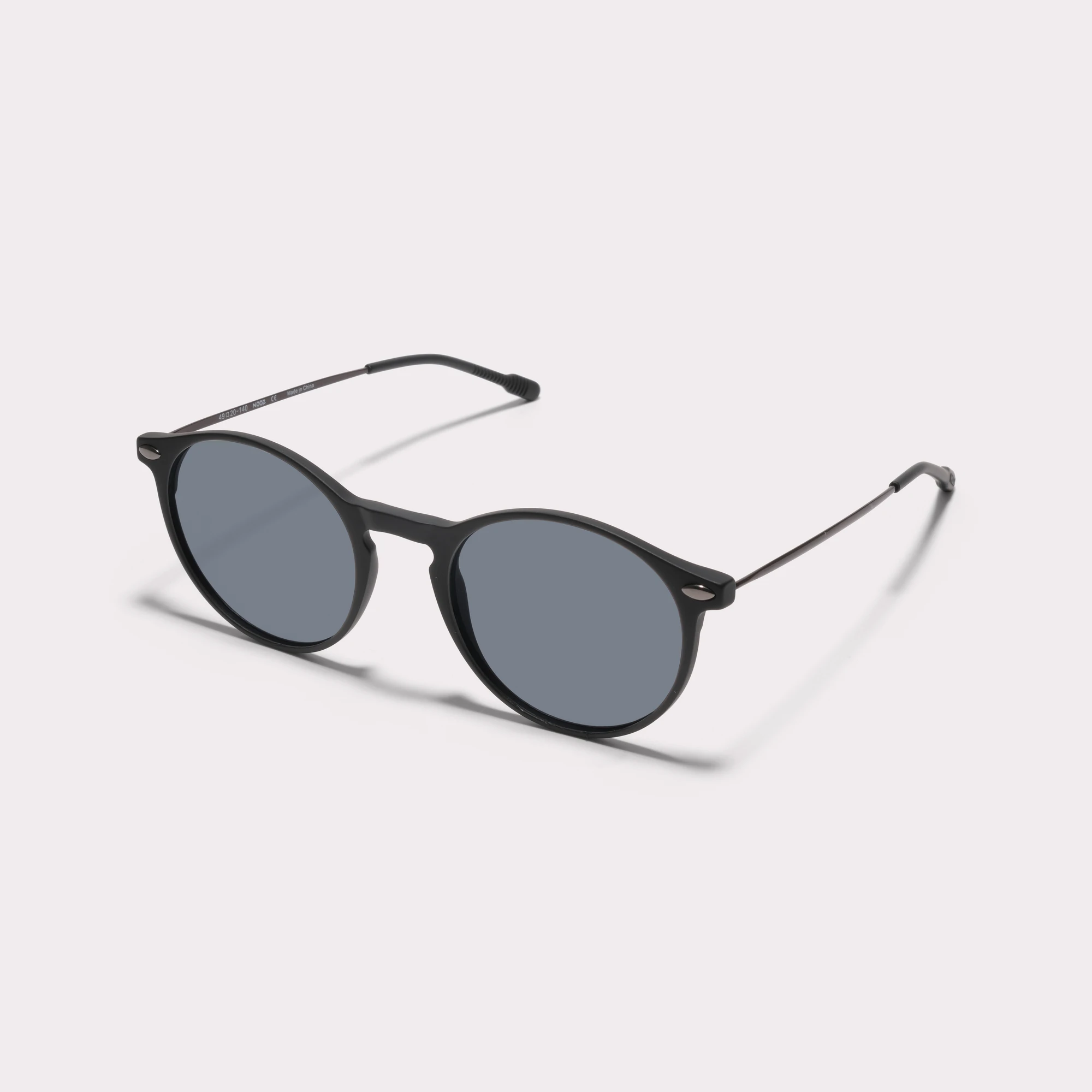 A pair of Cruz Black Sunglasses seen from the side