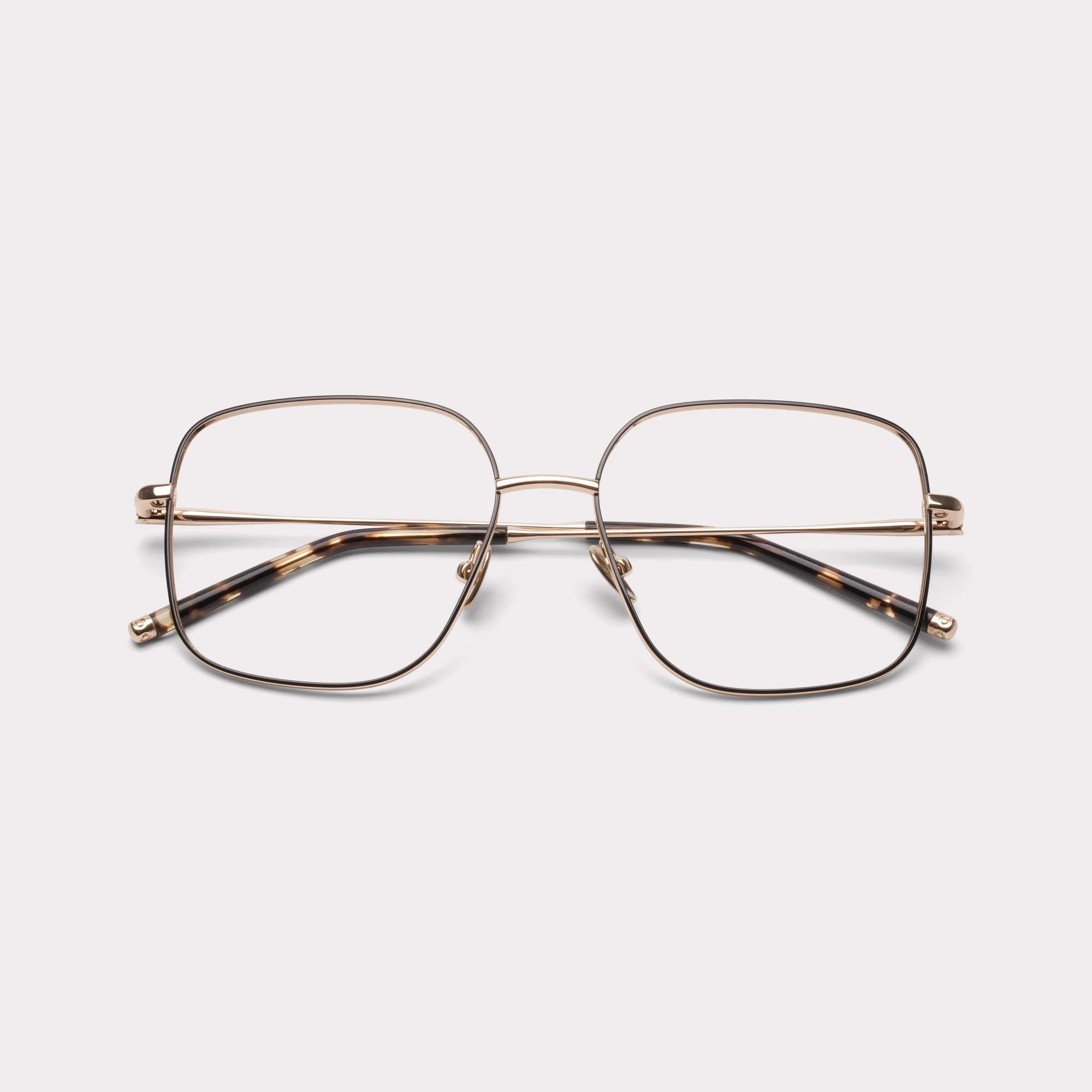A pair of Cleo Gold Prescription glasses folded